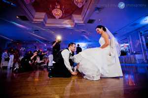 Tides Estate NJ Wedding pictures groom getting garter